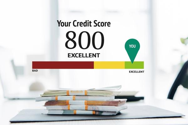 money on table with text overlay your credit score 800 excellent