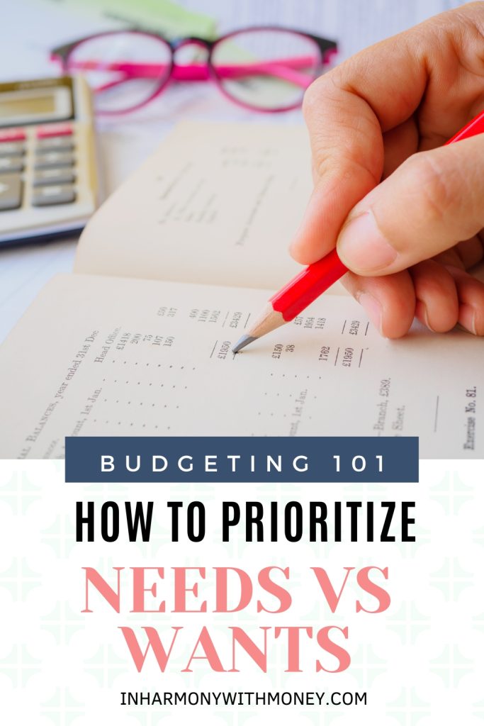 woman's hand holding a red pencil writing in budget with calculator and glasses in the background with text overlay budgeting 101 how to prioritize needs vs wants